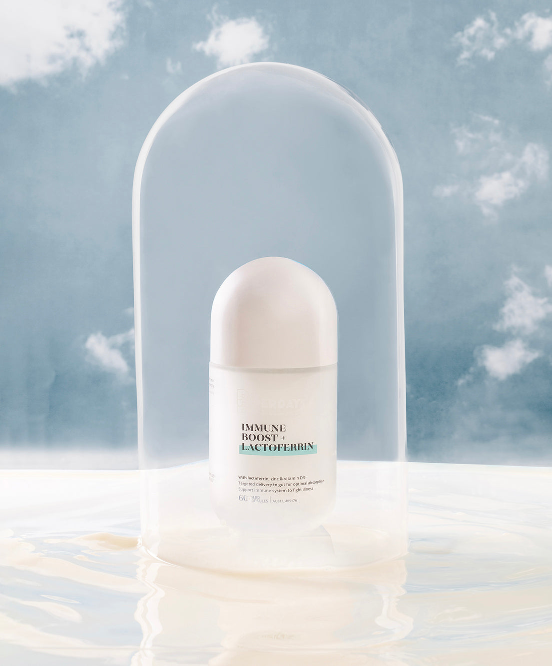bottle labeled 'Immune Boost + Lactoferrin' against a cloudy sky background