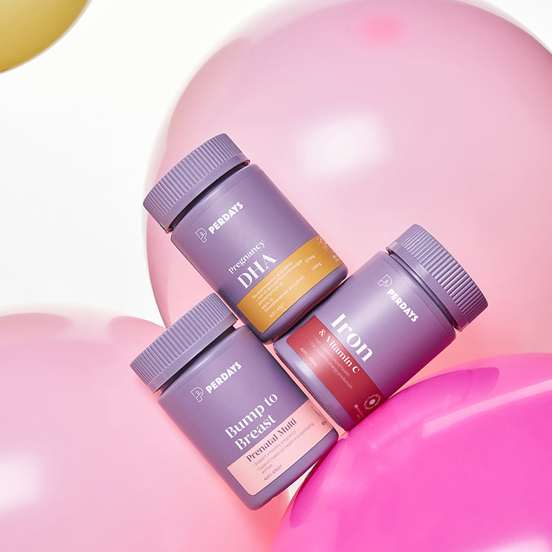 Three supplement bottles on a pink background