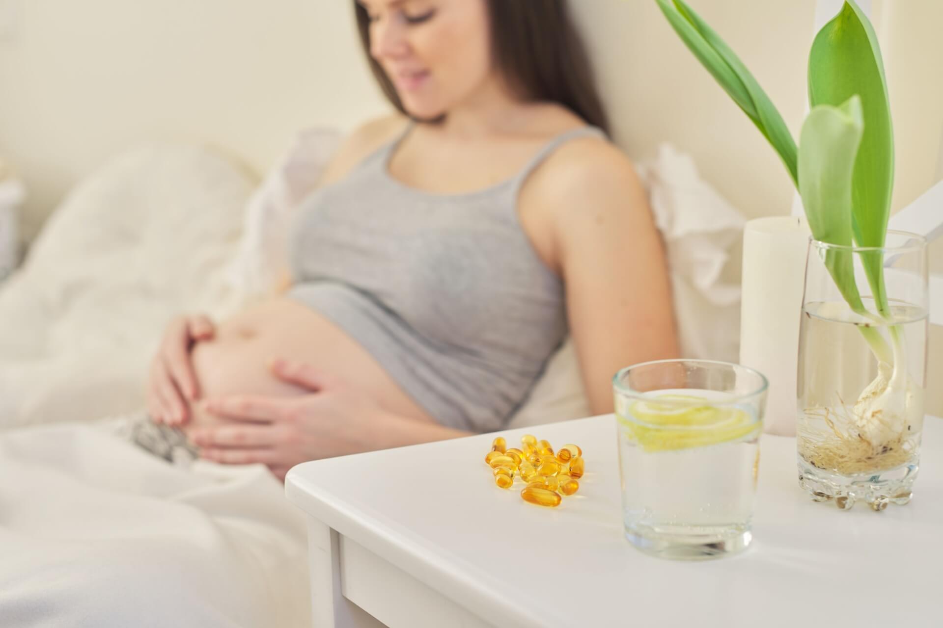 pregnant woman taking pregnancy vitamins